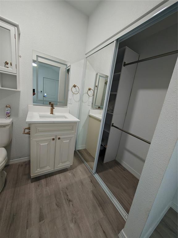 820 North Wekiwa Springs Road Apopka, FL 32712 - Photo 18 of 51 a room with a sink a toilet and a mirror