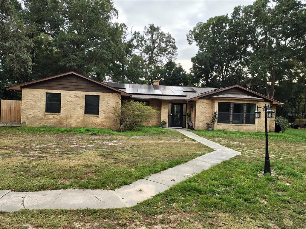 820 North Wekiwa Springs Road Apopka, FL 32712 - Photo 2 of 51 a front view of a house with a yard