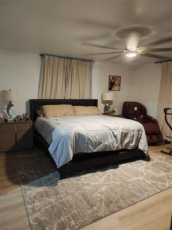 820 North Wekiwa Springs Road Apopka, FL 32712 - Photo 31 of 51 a bedroom with a bed and a couch