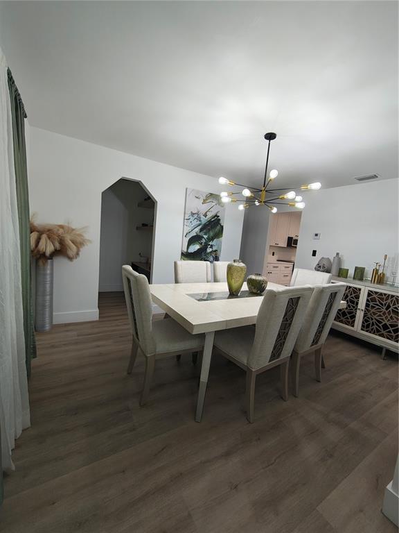 820 North Wekiwa Springs Road Apopka, FL 32712 - Photo 34 of 51 a dining room with furniture and wooden floor