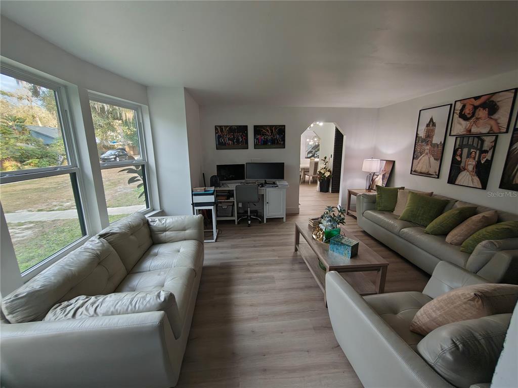 820 North Wekiwa Springs Road Apopka, FL 32712 - Photo 35 of 51 a living room with furniture and a large window