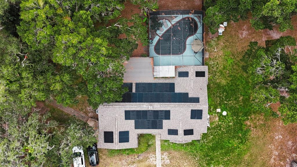 820 North Wekiwa Springs Road Apopka, FL 32712 - Photo 4 of 51 an aerial view of a house with a yard and large trees