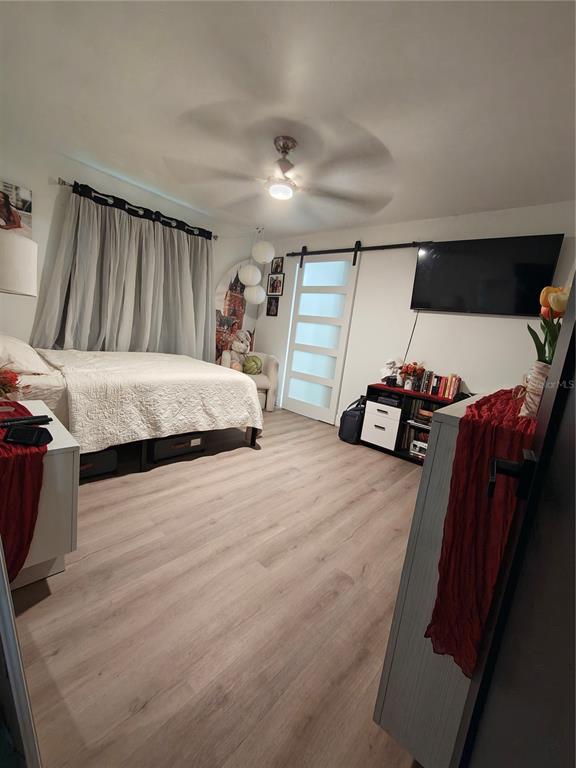 820 North Wekiwa Springs Road Apopka, FL 32712 - Photo 42 of 51 a bed room with a bed and a couch