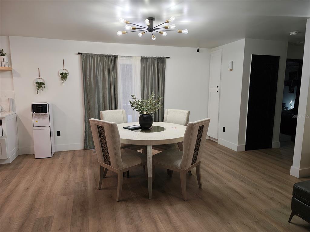 820 North Wekiwa Springs Road Apopka, FL 32712 - Photo 45 of 51 a view of a dining room with furniture and wooden floor