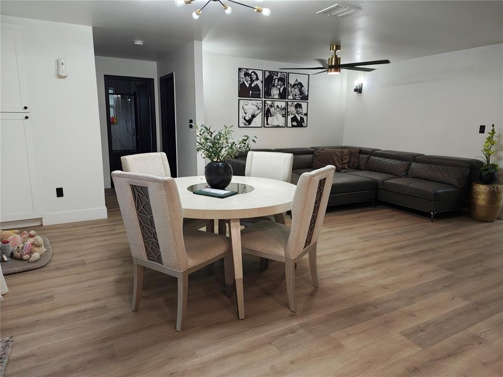 820 North Wekiwa Springs Road Apopka, FL 32712 - Photo 47 of 51 a view of a dining room with furniture and wooden floor