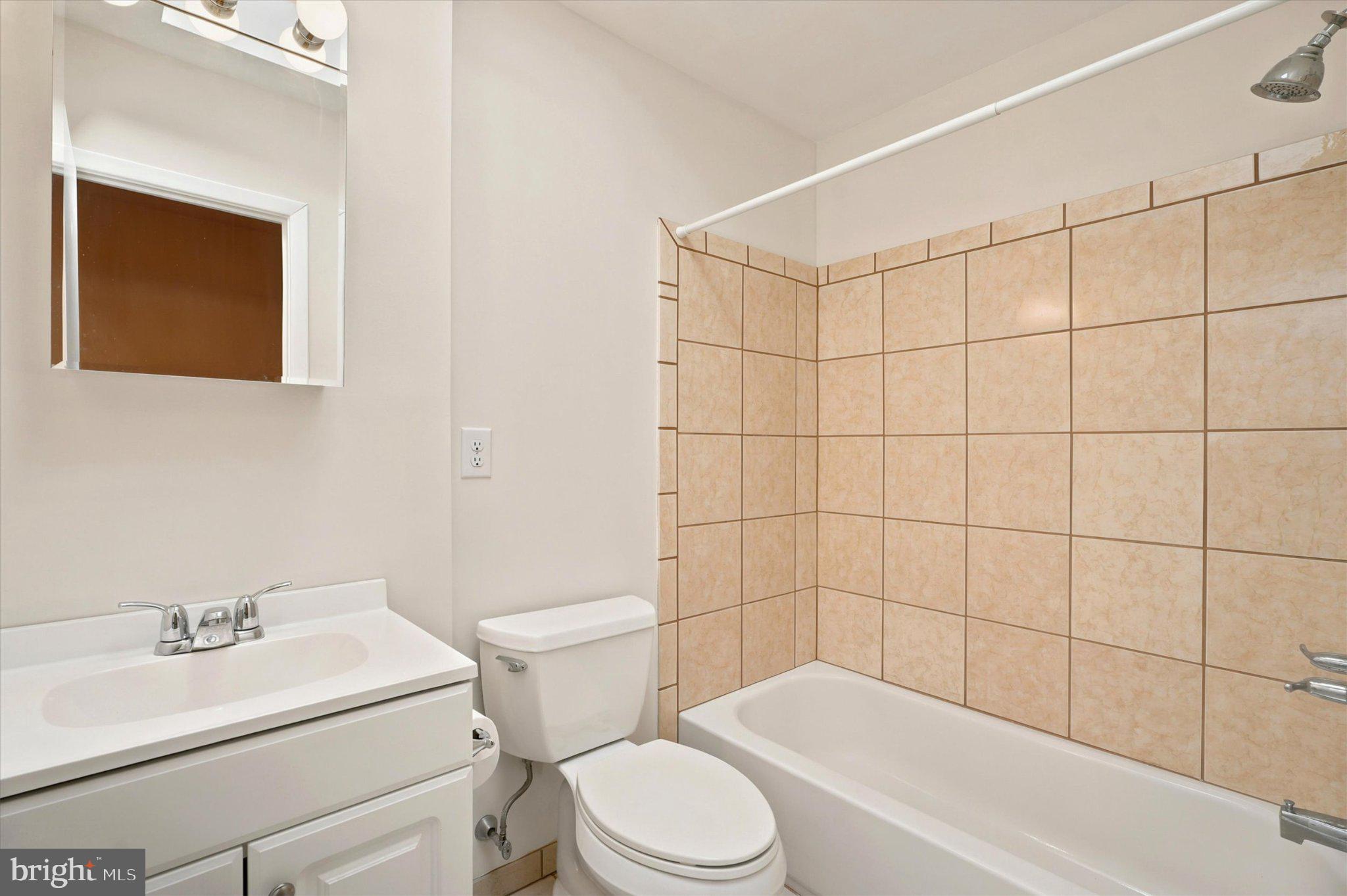668 Renz Street Philadelphia, PA 19128 - Photo 19 of 25 Modern bathroom with tiled elegance.
