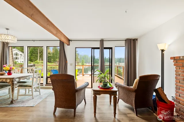 a view of a livingroom with furniture and a window