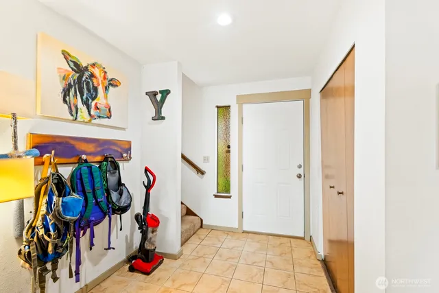 a view of walk in closet with clothes