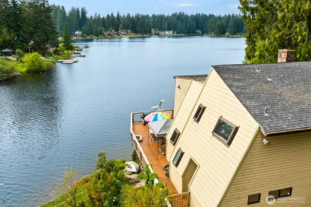 a view of a lake with a house in the background