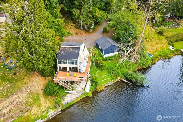 an aerial view of a house with a yard