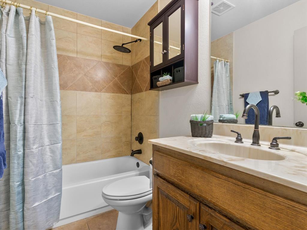 1311 Roe Helm Drive Rhome, TX 76078 - Photo 24 of 35 Guest bathroom with rain shower head