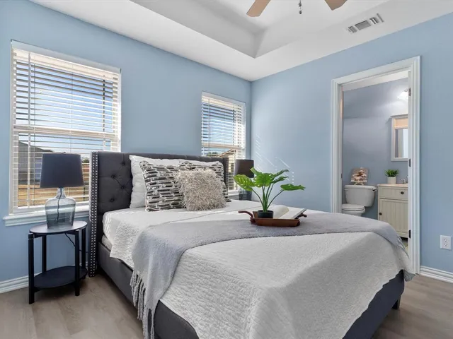 a bedroom with a bed and window