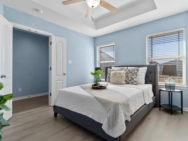 a bedroom with a bed and a table