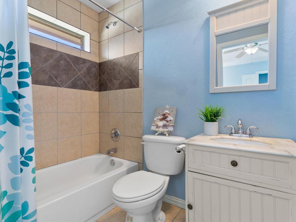 1311 Roe Helm Drive Rhome, TX 76078 - Photo 33 of 35 Full Bathroom for Mother-in-law suite, guest house or cacita! Any way you say it, it's a beautiful, cozy place for short or long-term guests