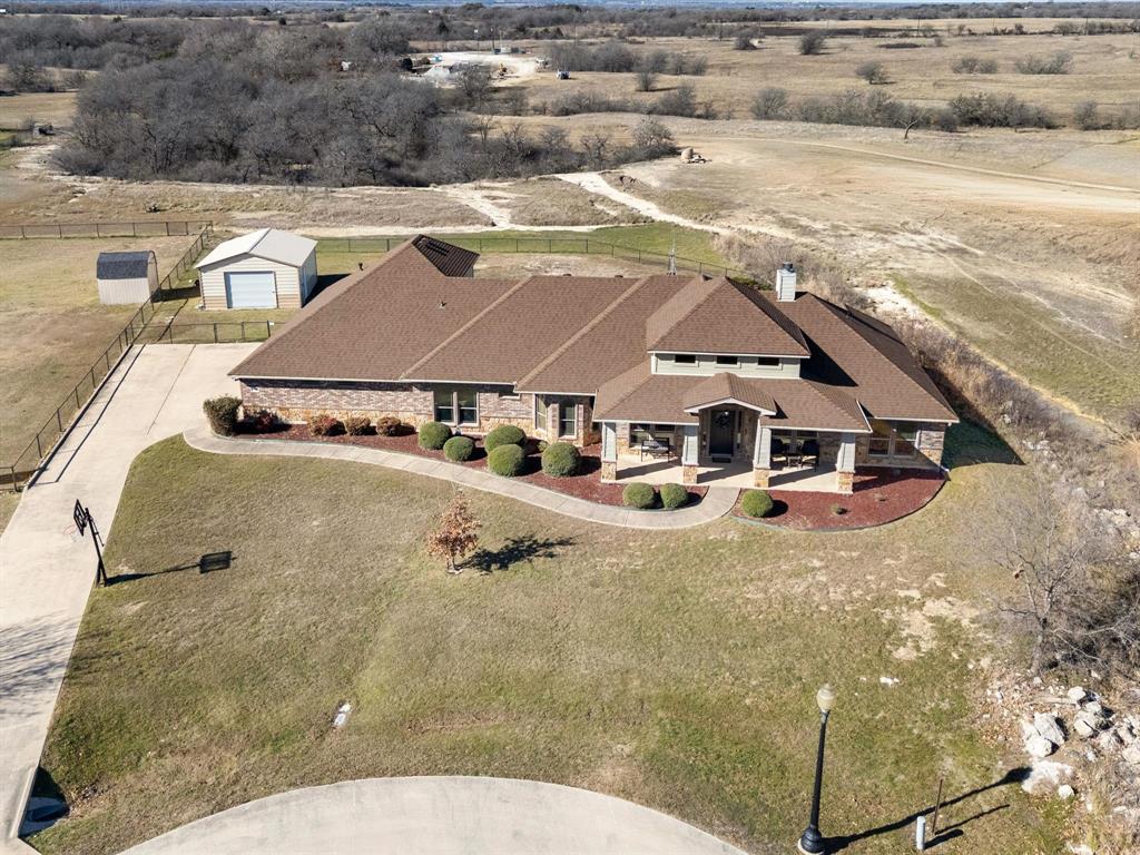 1311 Roe Helm Drive Rhome, TX 76078 - Photo 34 of 35 Luxury custom home on oversized lot with pool, guest house or mother-in-law suite, and workshop with electricity in Rhome, Texas