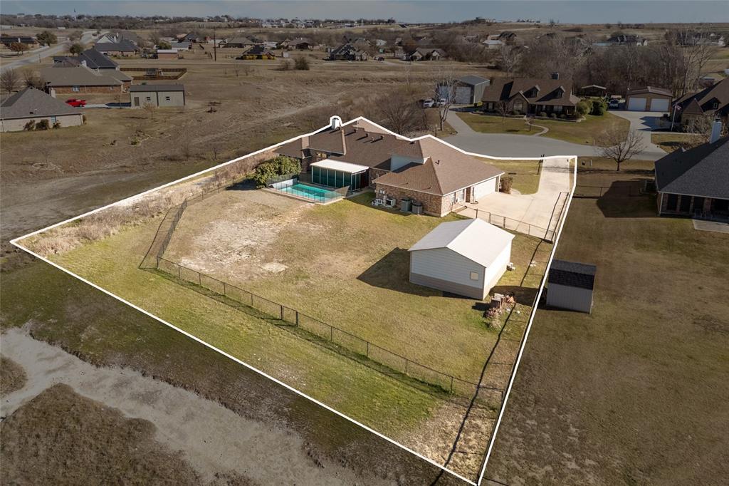 1311 Roe Helm Drive Rhome, TX 76078 - Photo 35 of 35 Luxury custom home on oversized lot with pool, guest house or mother-in-law suite, and workshop with electricity in Rhome, Texas