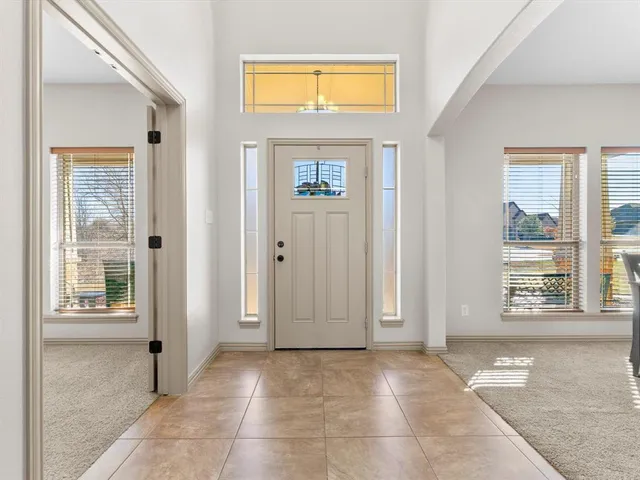 a view of a hallway with windows