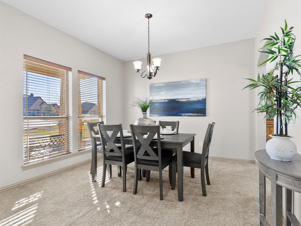 1311 Roe Helm Drive Rhome, TX 76078 - Photo 5 of 35 Formal dining area conveniently located by the kitchen, large enough for seating for 6-8