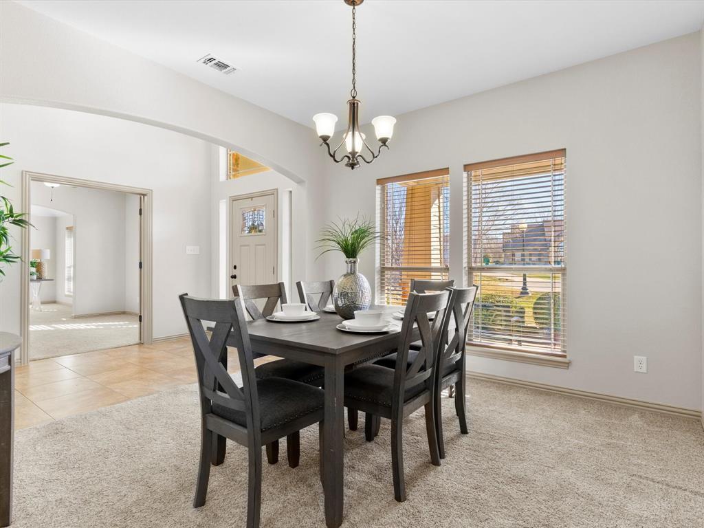 1311 Roe Helm Drive Rhome, TX 76078 - Photo 6 of 35 Formal dining area conveniently located by the kitchen, large enough for seating for 6-8