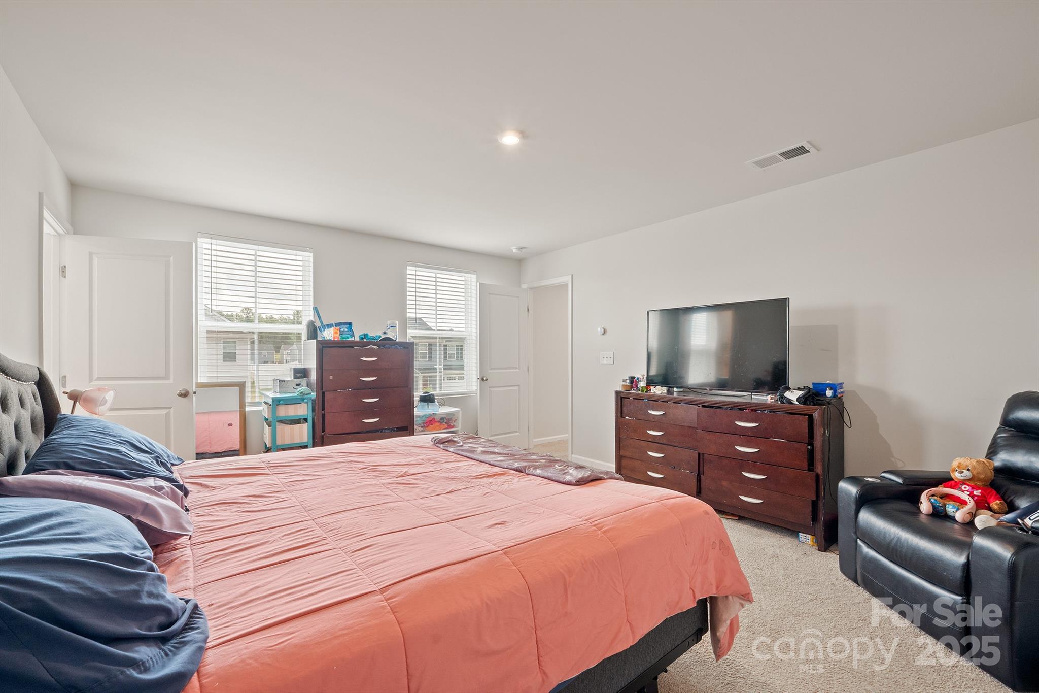 707 Point Andrews Drive Southwest Concord, NC 28025 - Photo 17 of 24 a bedroom with a bed and dresser