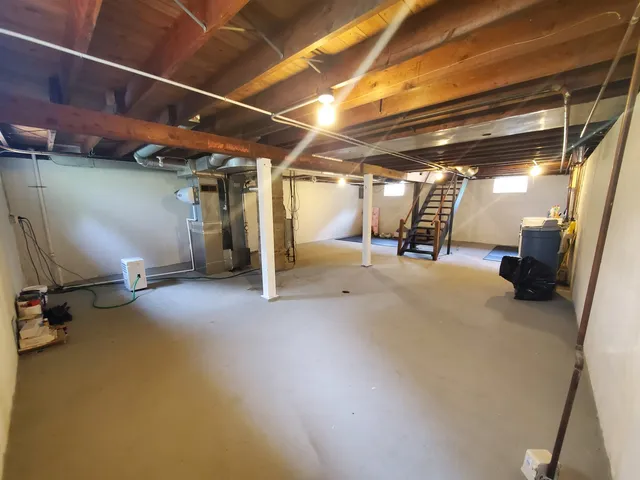 a view of empty room with wooden walls