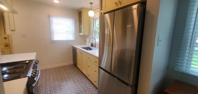 a bathroom with a sink a mirror and a bathtub