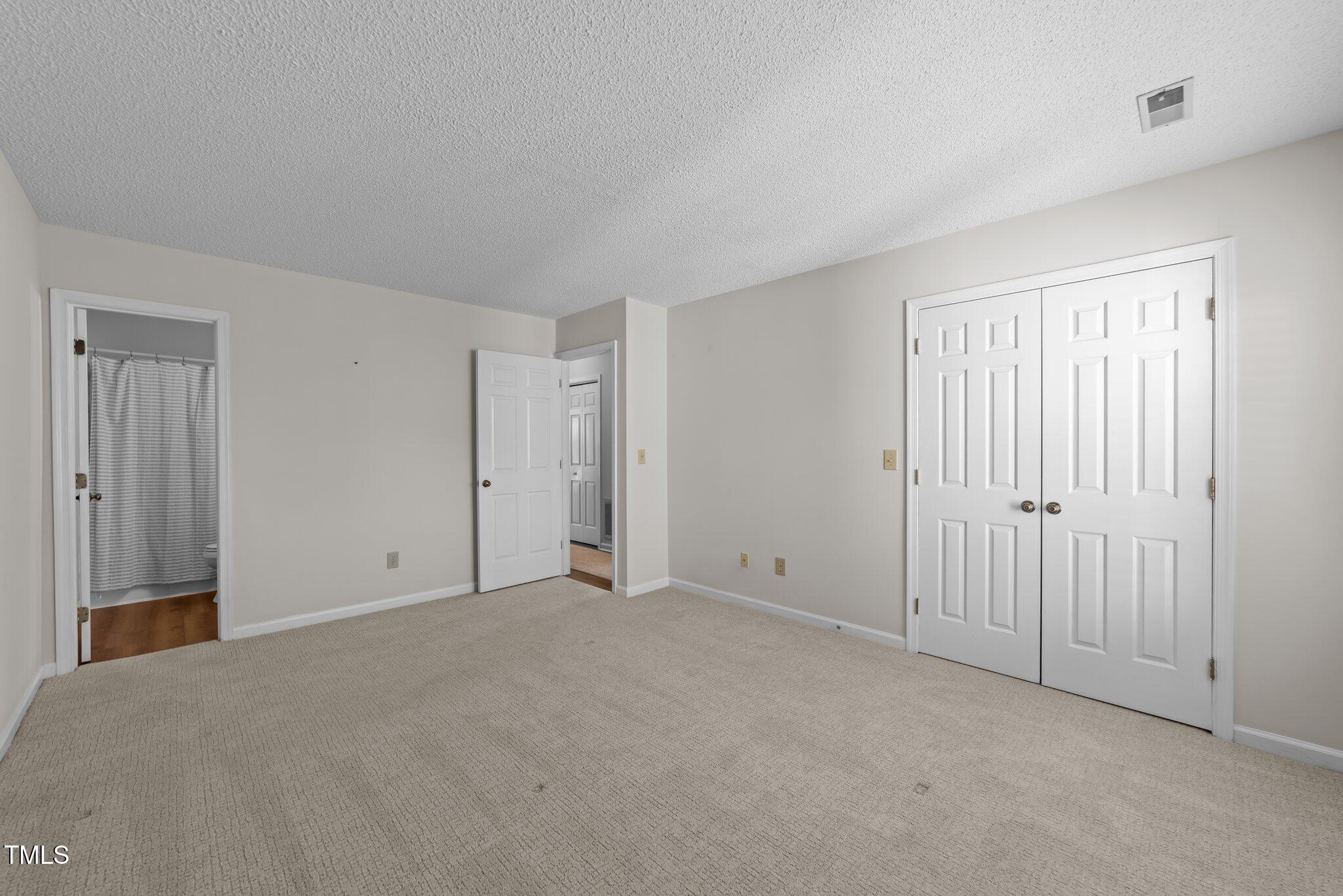 6817 Fairpoint Court Raleigh, NC 27613 - Photo 12 of 25 a view of an empty room and closet area