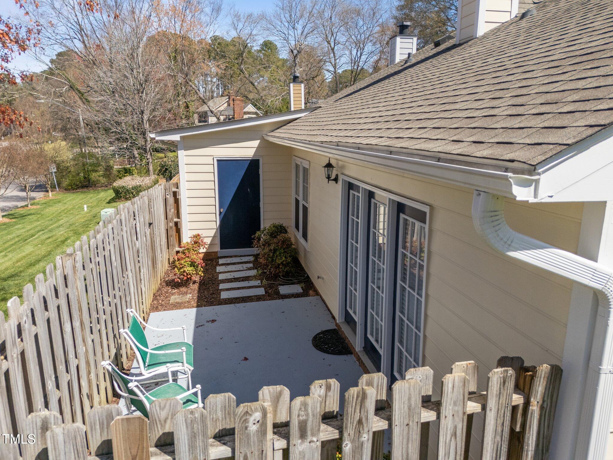 6817 Fairpoint Court Raleigh, NC 27613 - Photo 18 of 25 a view of a house with wooden fence