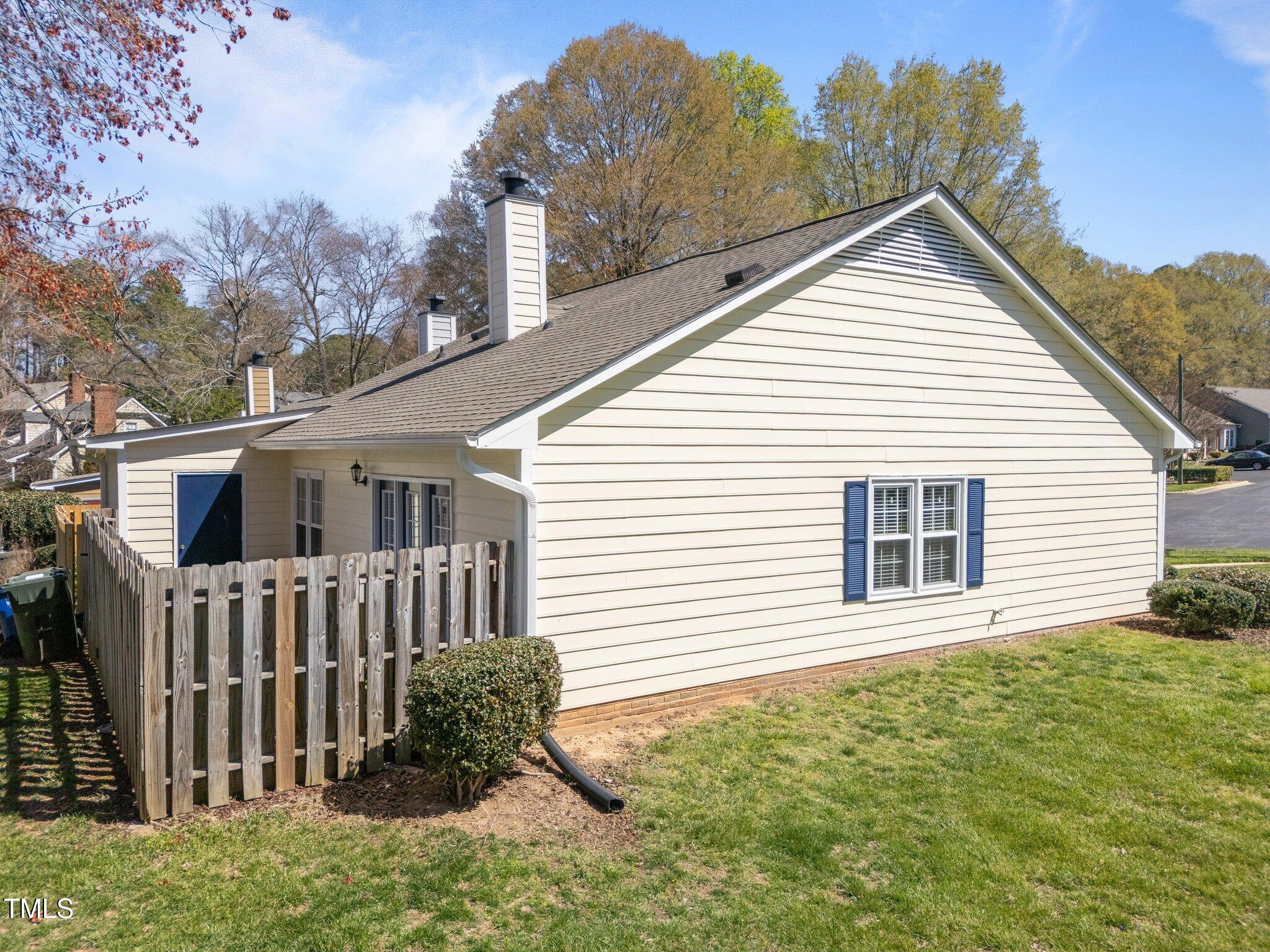 6817 Fairpoint Court Raleigh, NC 27613 - Photo 19 of 25 a view of a house with a yard