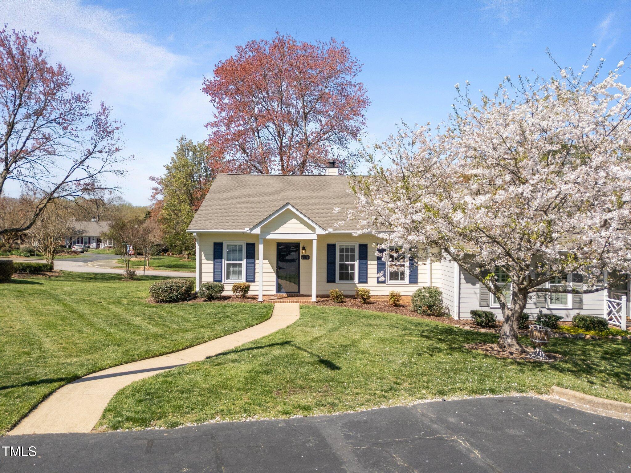6817 Fairpoint Court Raleigh, NC 27613 - Photo 3 of 25 a front view of a house with a yard