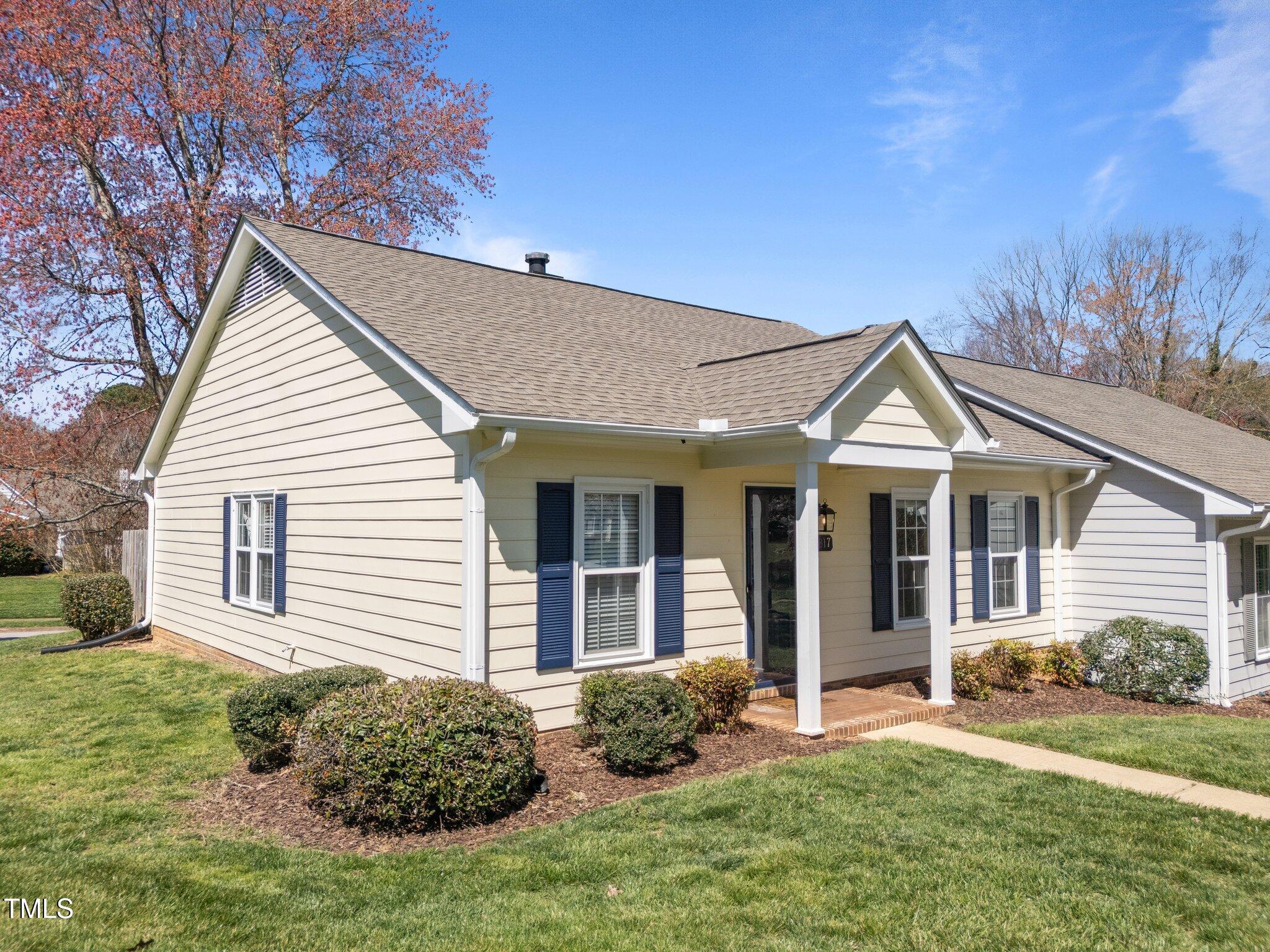 6817 Fairpoint Court Raleigh, NC 27613 - Photo 4 of 25 a view of a house with a yard and plants