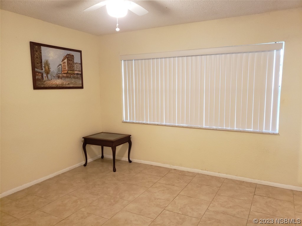 1867 Pine Tree Drive Edgewater, FL 32141 - Photo 12 of 21 a view of a small space with wooden floor and a window