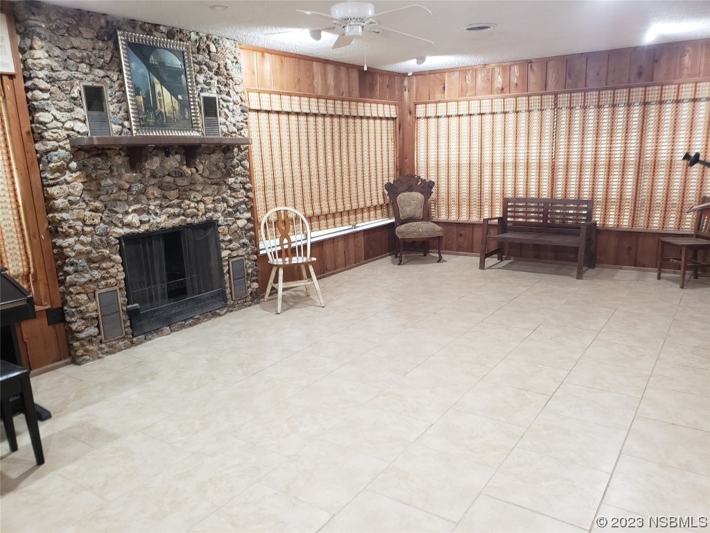 1867 Pine Tree Drive Edgewater, FL 32141 - Photo 15 of 21 a living room with furniture and a fireplace