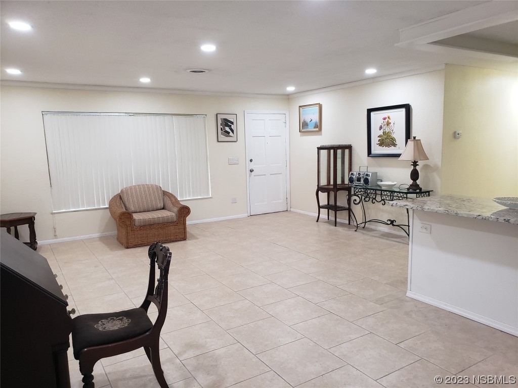 1867 Pine Tree Drive Edgewater, FL 32141 - Photo 20 of 21 a living room with furniture and a table
