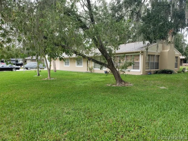 a house view with a garden space