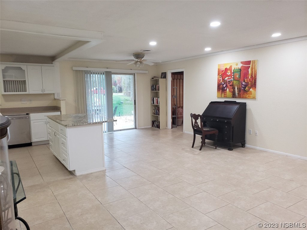 1867 Pine Tree Drive Edgewater, FL 32141 - Photo 8 of 21 a living room with furniture and large windows