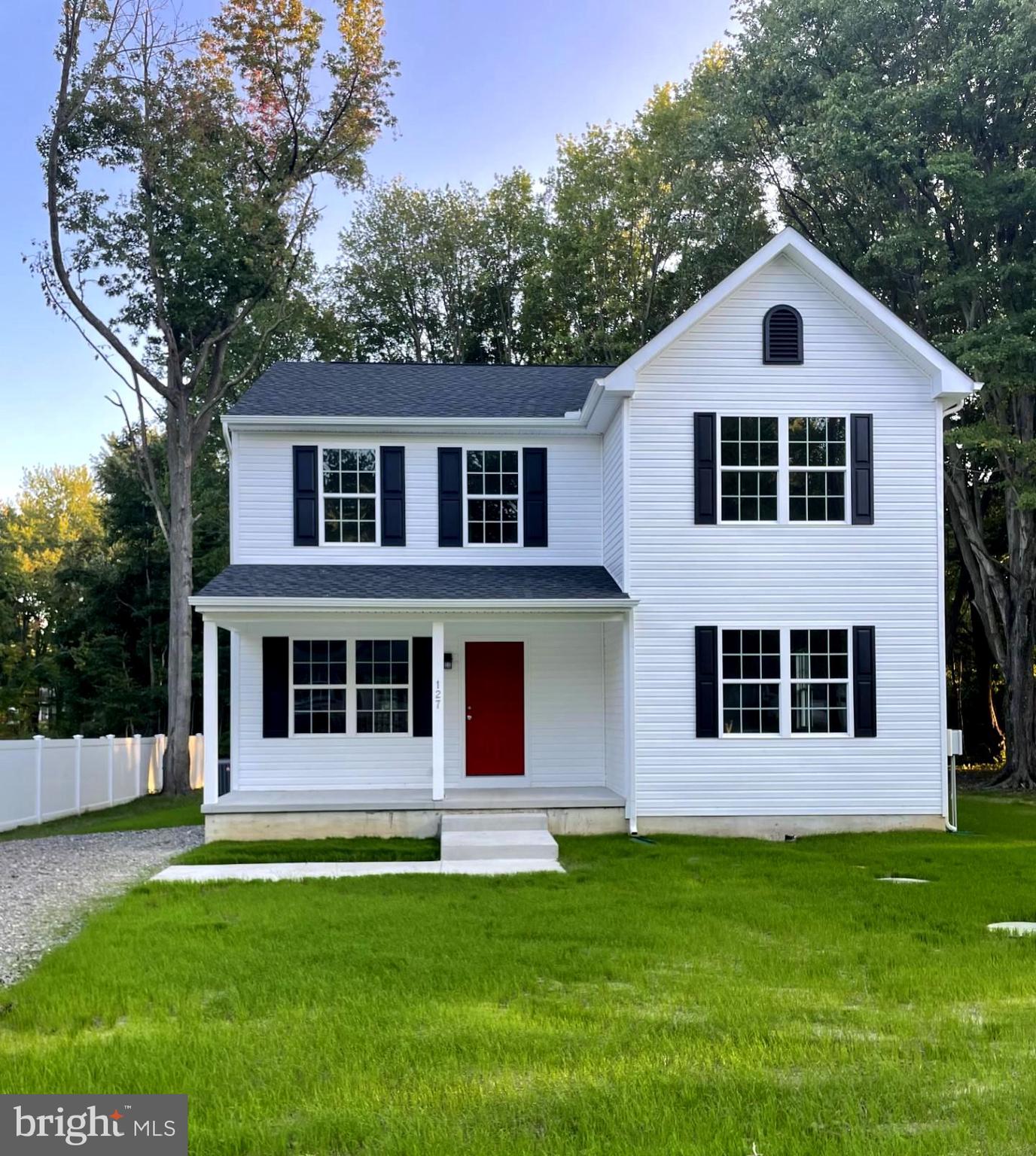 127 Tennessee Road Stevensville, MD 21666 - Photo 1 of 33 a front view of a house with a yard