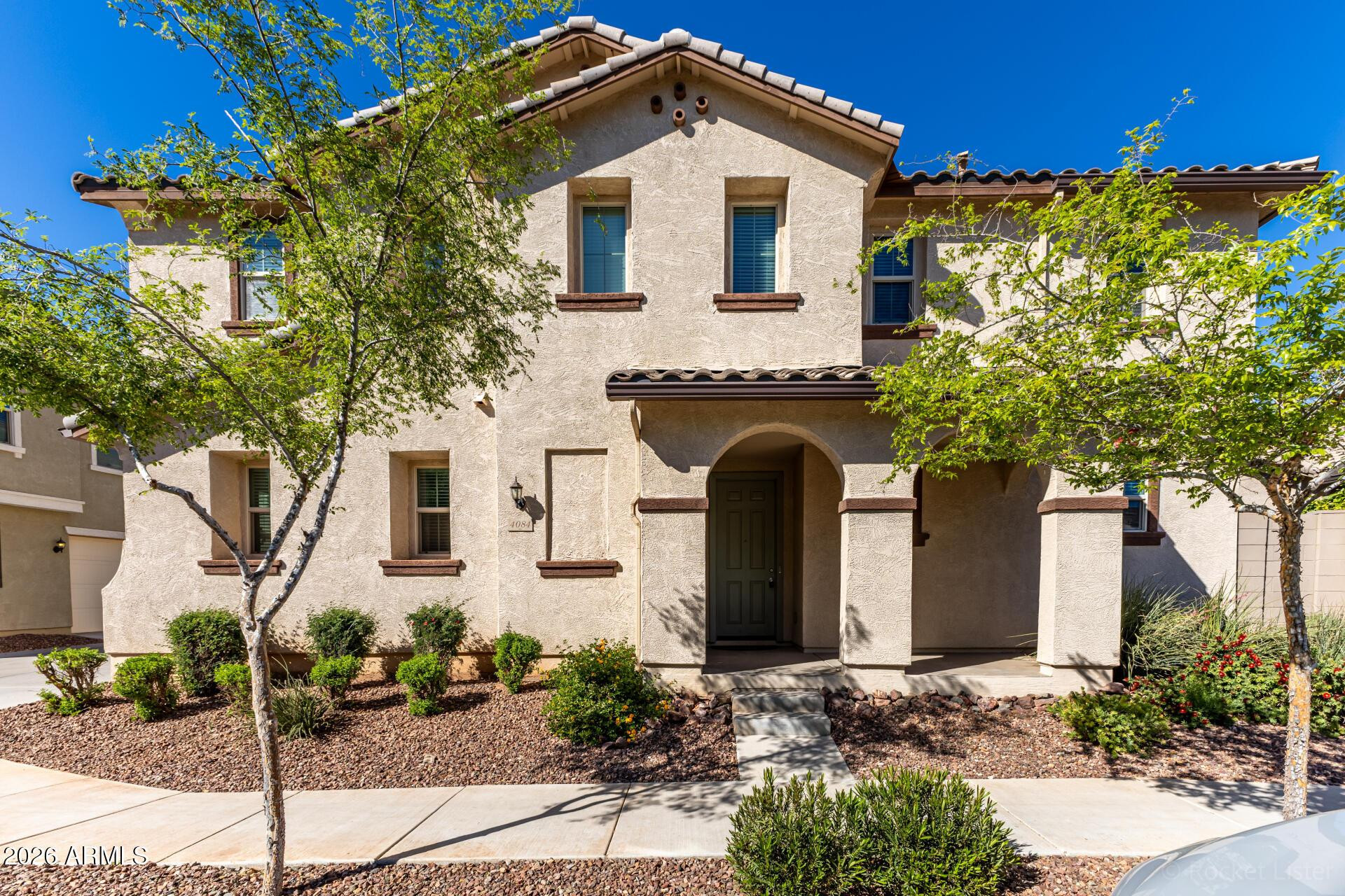 4084 East Ranch Road Gilbert, AZ 85296 - Photo 1 of 33 a front view of a house with plants