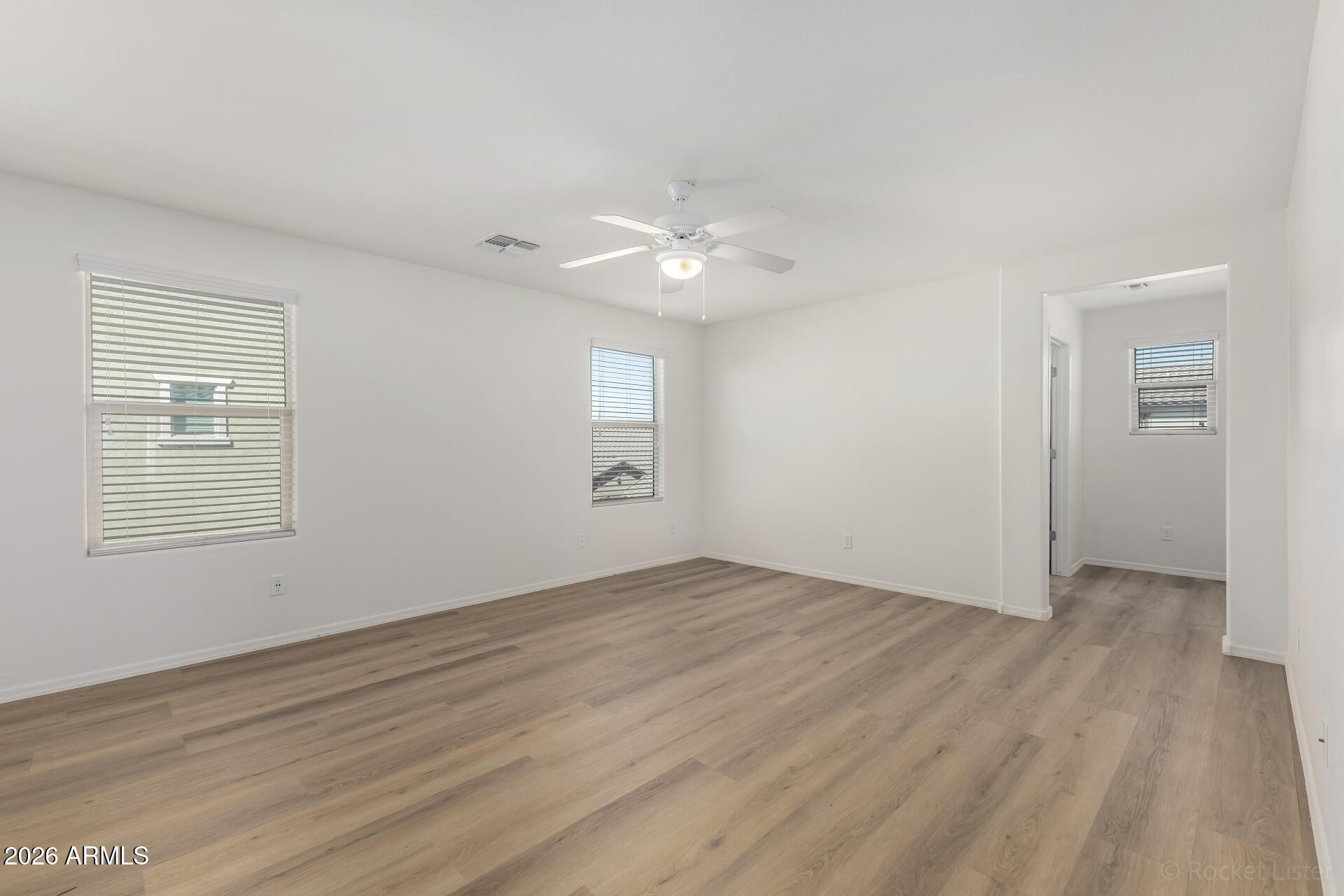 4084 East Ranch Road Gilbert, AZ 85296 - Photo 12 of 33 wooden floor in an empty room with a window