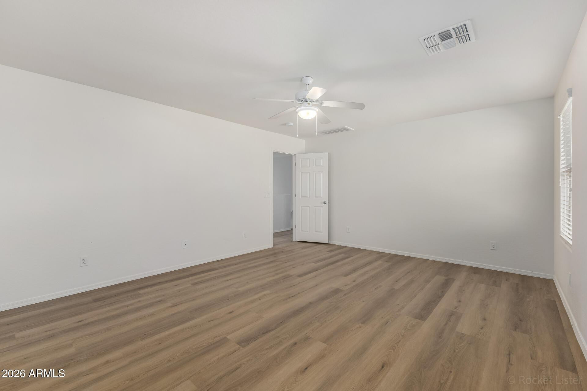 4084 East Ranch Road Gilbert, AZ 85296 - Photo 13 of 33 wooden floor in an empty room
