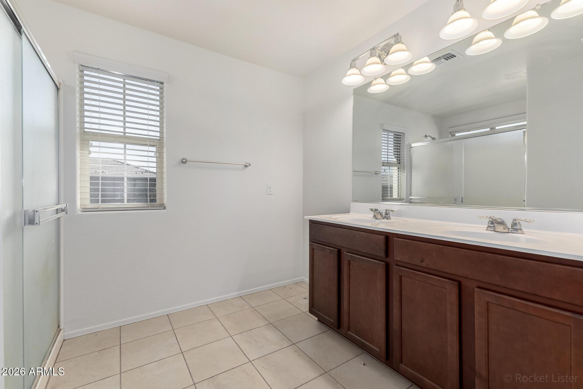 4084 East Ranch Road Gilbert, AZ 85296 - Photo 14 of 33 a bathroom with a double vanity sink and a mirror