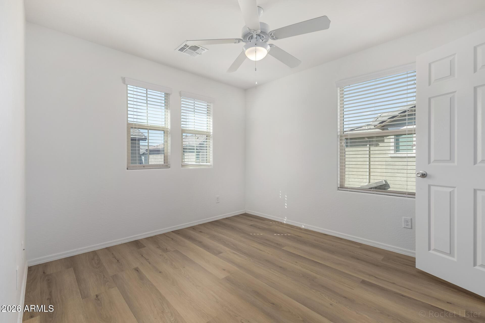 4084 East Ranch Road Gilbert, AZ 85296 - Photo 19 of 33 a view of empty room with wooden floor and fan