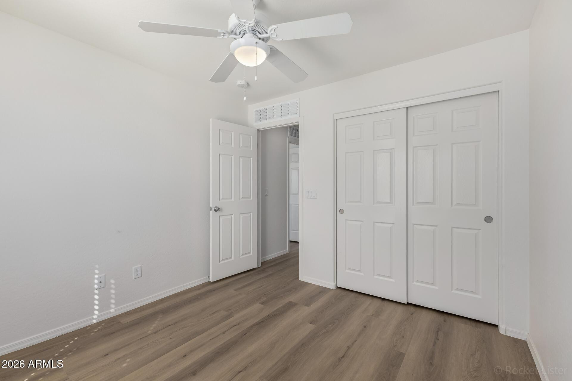 4084 East Ranch Road Gilbert, AZ 85296 - Photo 20 of 33 a view of an empty room with wooden floor