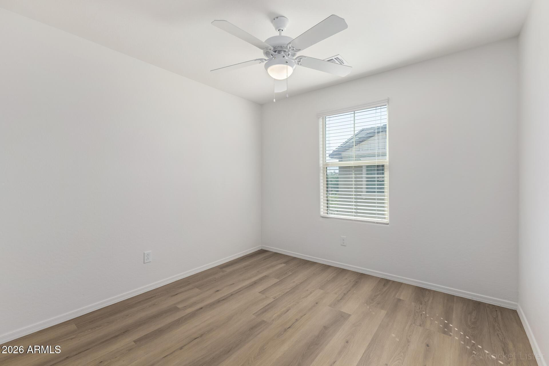 4084 East Ranch Road Gilbert, AZ 85296 - Photo 21 of 33 wooden floor in an empty room with a window