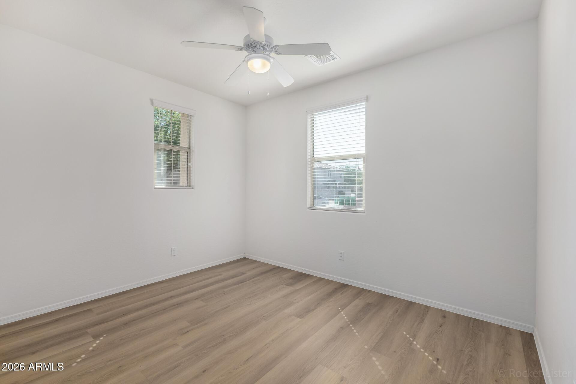 4084 East Ranch Road Gilbert, AZ 85296 - Photo 23 of 33 wooden floor in an empty room with a window