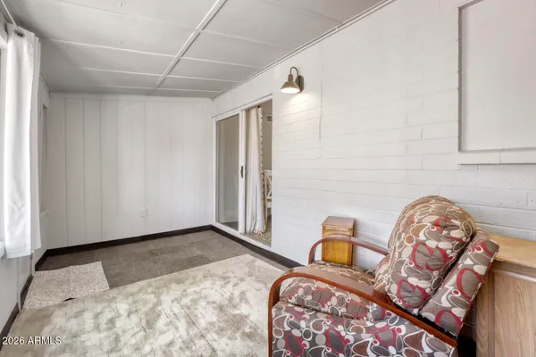 a bedroom with a bed and a television