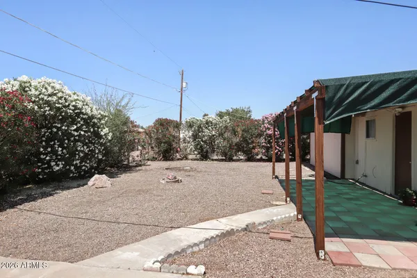 a view of a house next to a yard