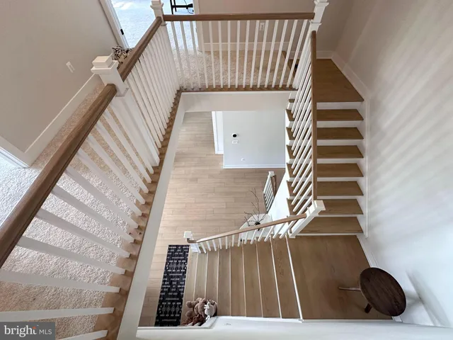 a bathroom with double vanity sink and a mirror
