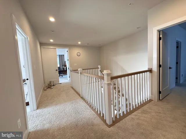 a bedroom with a bed and a desk