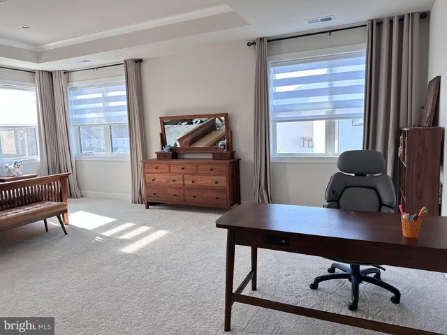 a bathroom with a sink a toilet and a shower